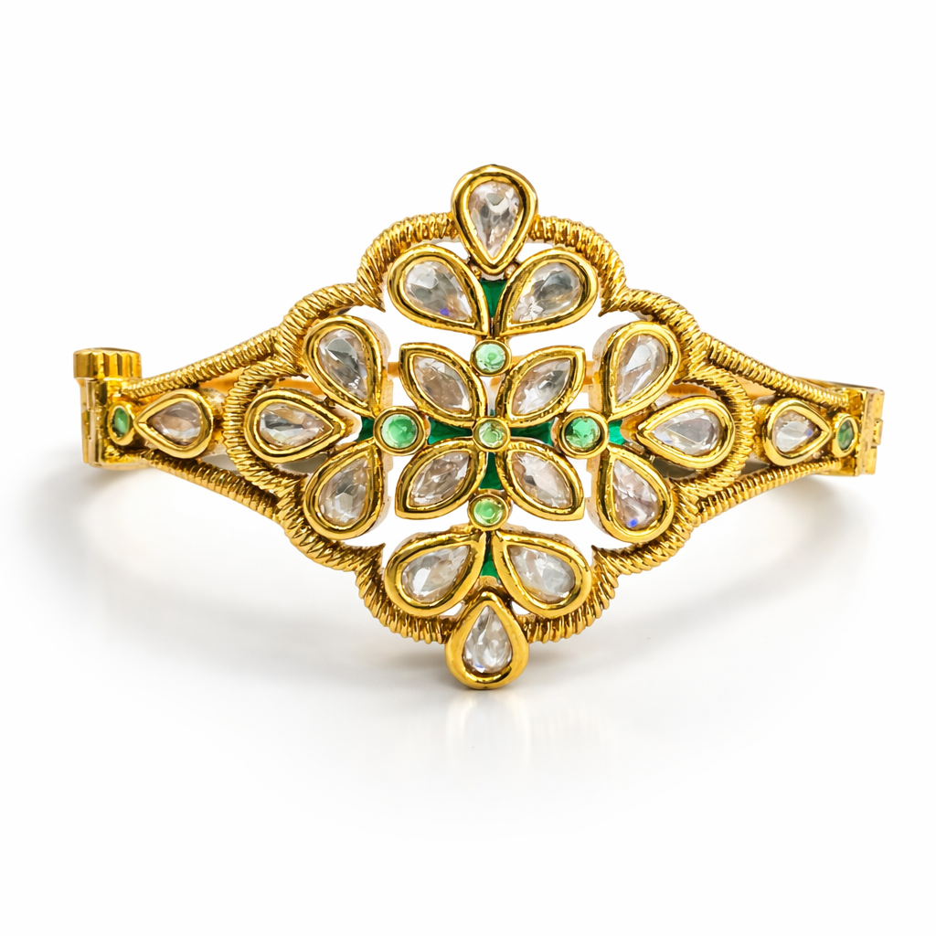 Gold-plated Kundan floral bracelet by Jinam featuring intricate gemstone detailing and elegant design.