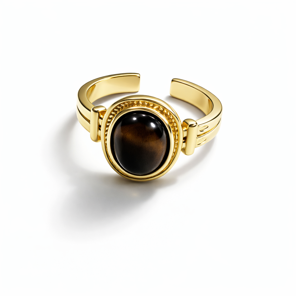 Vintage Tiger Eye oval adjustable ring by Jinam featuring a warm, polished gemstone set in a sleek metal band.