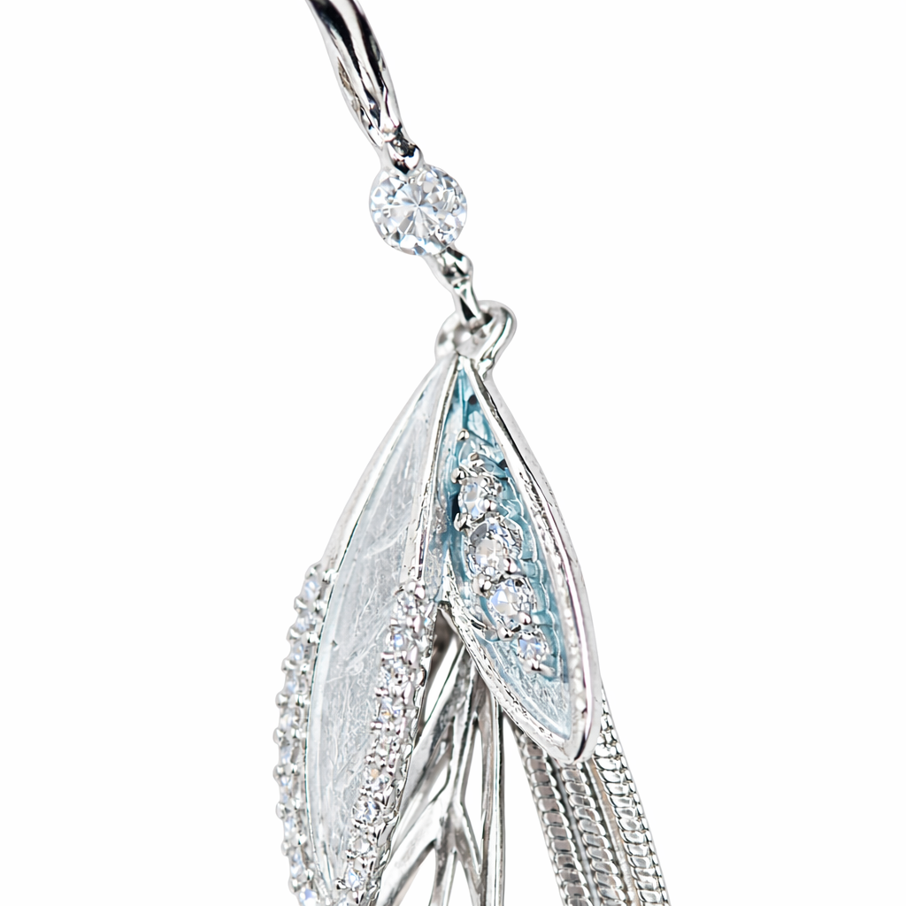 Silver-plated long tassel earrings by Jinam featuring elegant, flowing tassels hanging from sleek hooks.