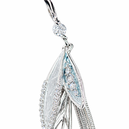 Silver-plated long tassel earrings by Jinam featuring elegant, flowing tassels hanging from sleek hooks.