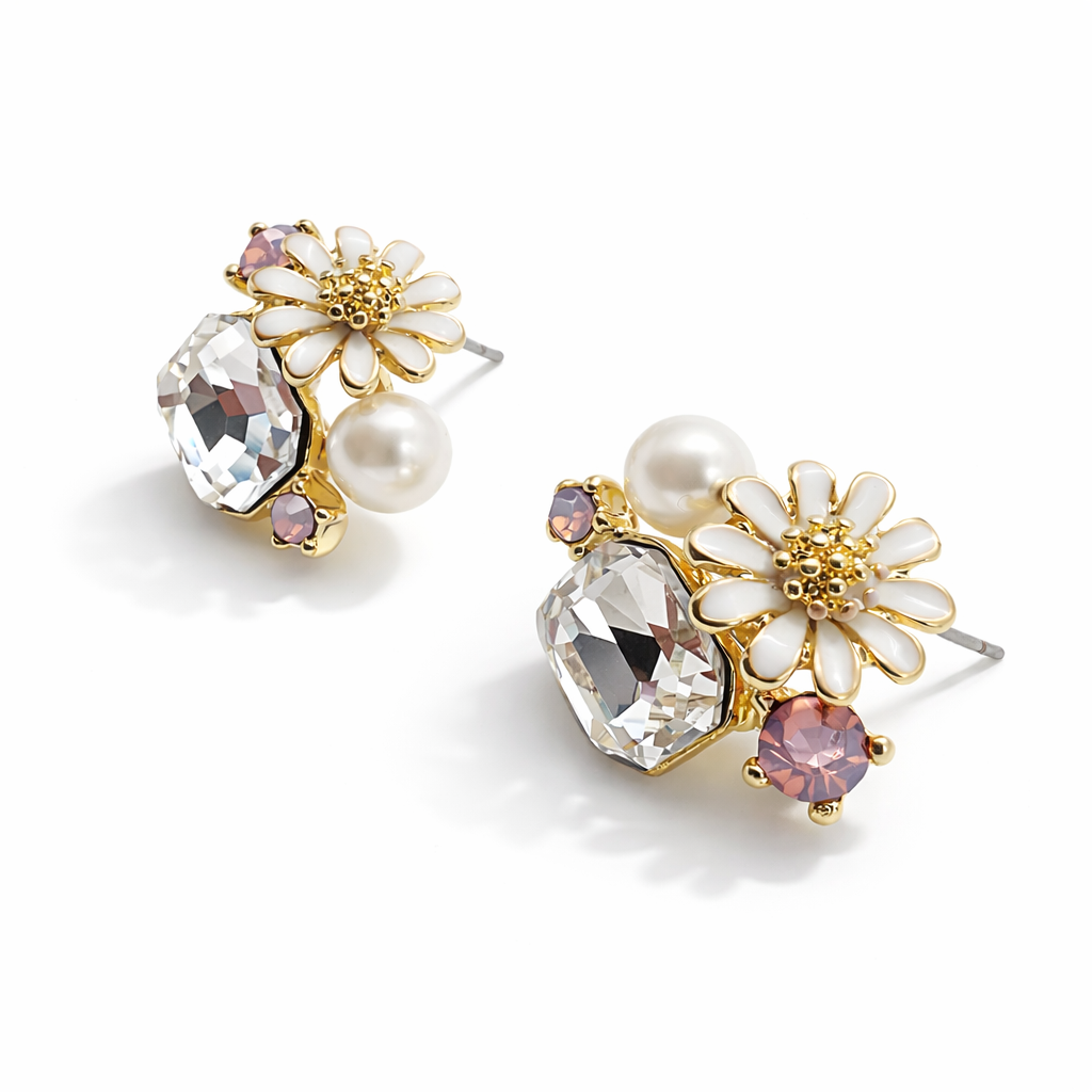 Jinam floral crystal cluster pendant and white enamel daisy earrings set, featuring delicate flower designs and sparkling crystal details.