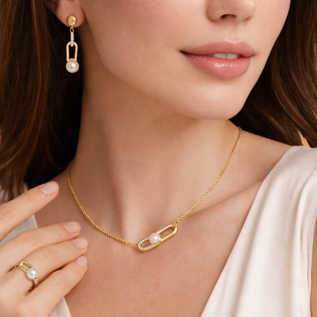 Gold-plated pearl link jewelry set for women including pendant necklace, earrings, and ring with CZ accents and anti-tarnish finish.