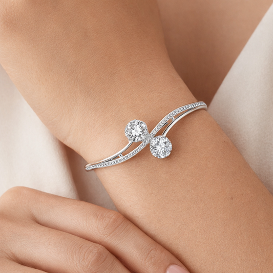 Silver-plated dual floral CZ bracelet by Jinam featuring intricate flower designs and sparkling cubic zirconia accents.