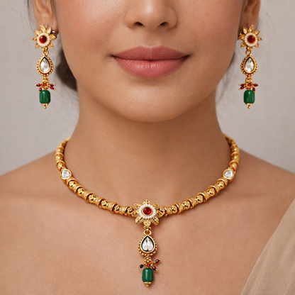 Jinam Floral Grace Ruby Emerald Necklace Set featuring a detailed floral design with vibrant red and green gemstones.