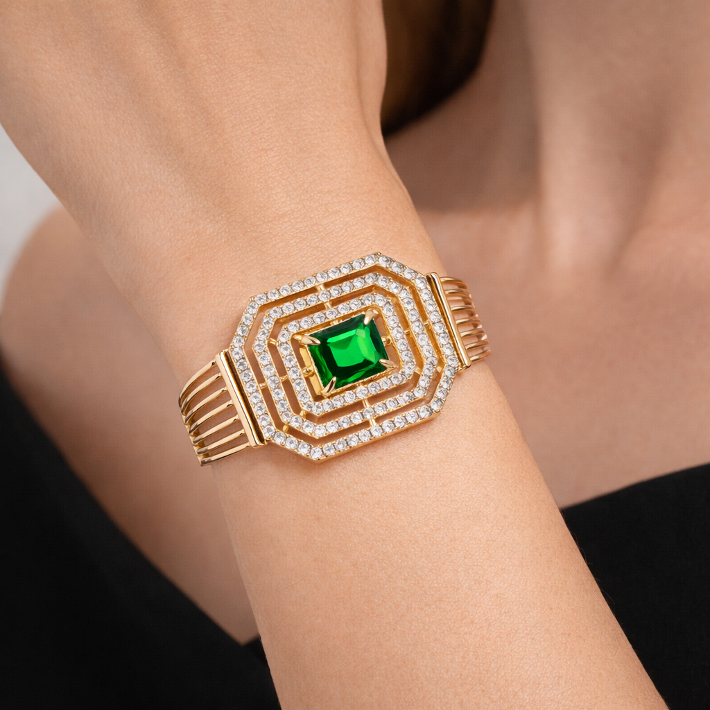 Gold-plated emerald octagon bracelet by Jinam featuring a sleek design with emerald gemstone accents.