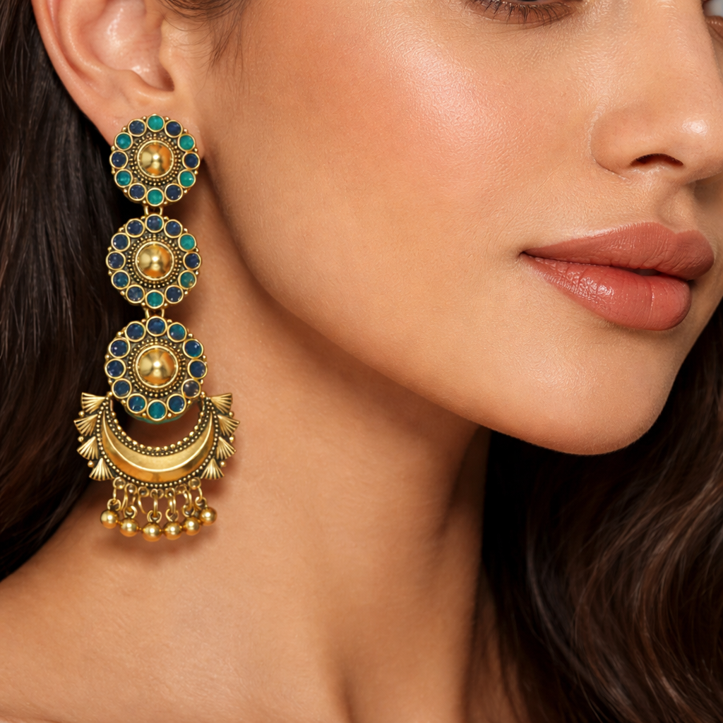 Antique gold-plated long dangler earrings with intricate design, made by Jinam, featuring elegant hanging details.
