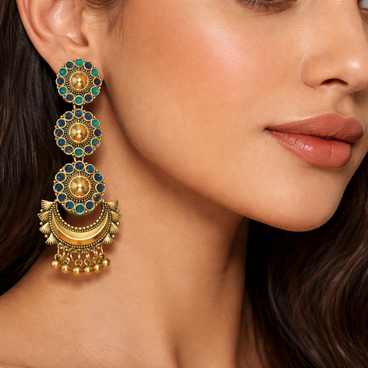 Antique gold-plated long dangler earrings with intricate design, made by Jinam, featuring elegant hanging details.