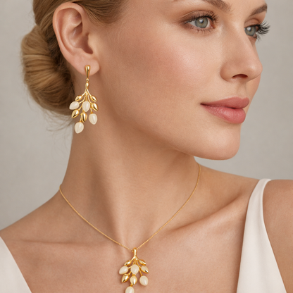Gold-plated leaf cluster pendant and earrings set by Jinam, featuring intricate leaf designs for elegant jewelry.