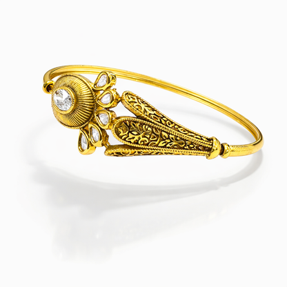 Jinam Royal Kundan Bloom Gold Bracelet featuring intricate Kundan designs and floral accents on a delicate gold band.