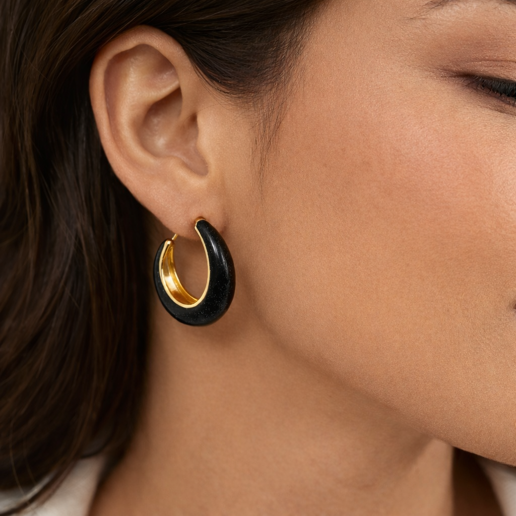 Black enamel chunky hoop earrings from Jinam featuring bold, circular stainless steel design with a smooth finish.