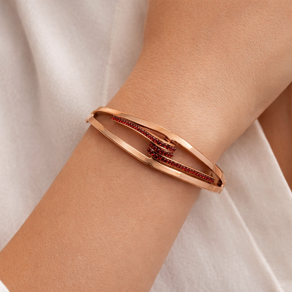 Rose Gold Knot Bracelet with Red Crystal Accents