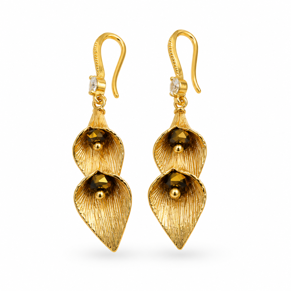 Close up of double gold calla lily leaf drop earrings with smoky crystal beads and CZ hook