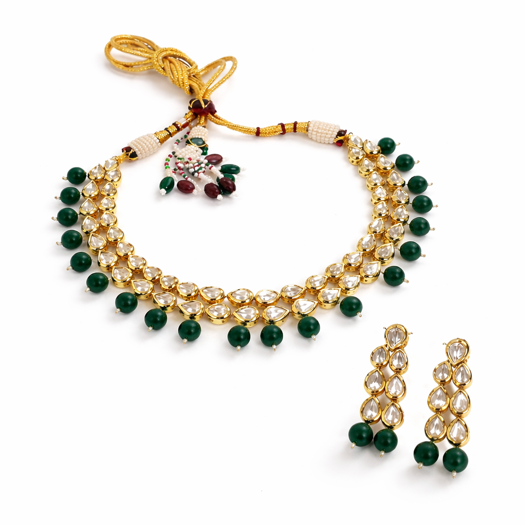 Jinam Emerald Grace Kundan imitation necklace set featuring intricate green and gold jewelry with matching earrings and traditional design.